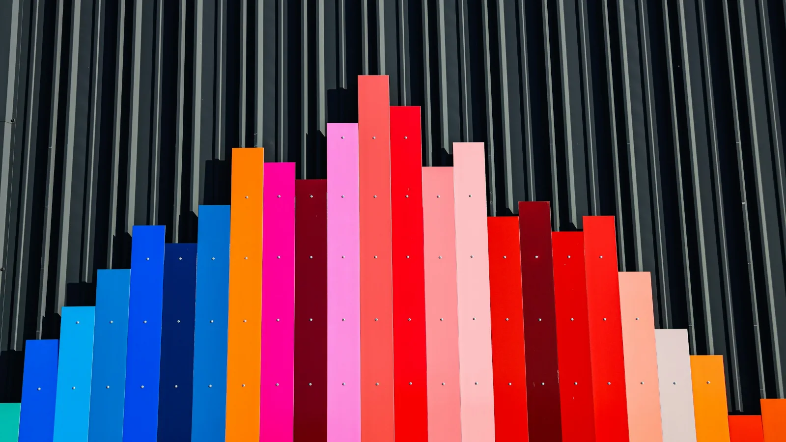 Coloured panels of different heights on a wall, like a bar chart