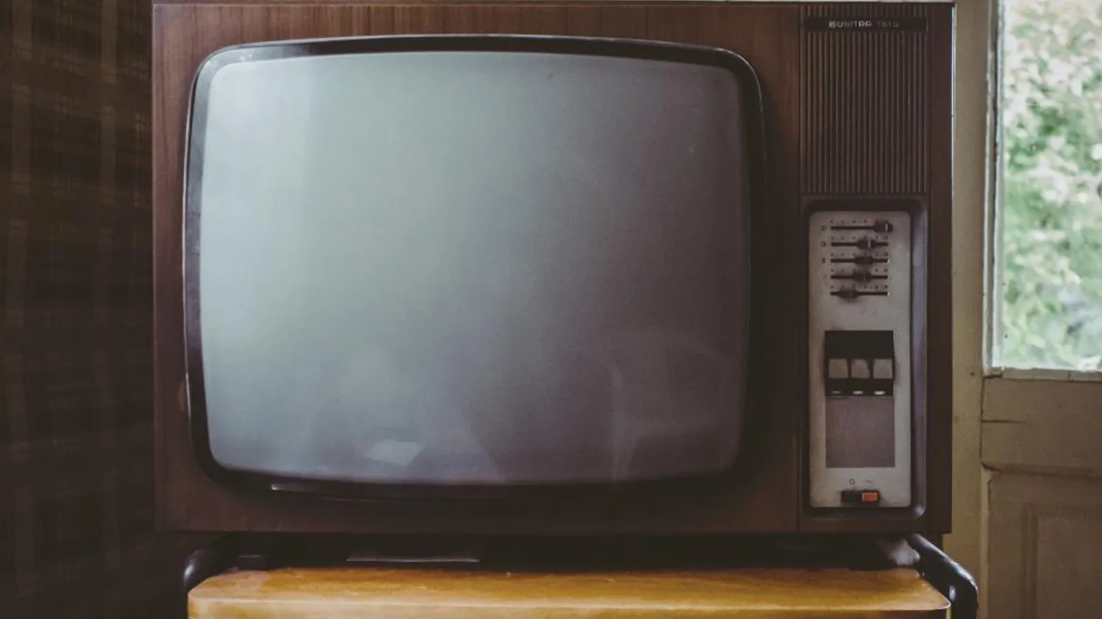 An old television set with a blank screen